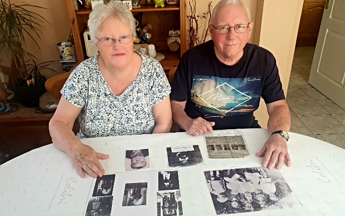 Geoff and Susan with pics of uncles