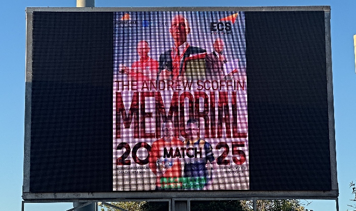 Pitchside media screen showing a Andrew Scoffin Memorial Match graphic (1)