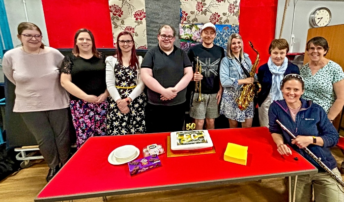 Some of the Nantwich Concert Band around their 50 members celebration cake (1)