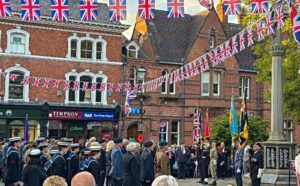 Standard bearers, cadets and dignitaries stand upright prior to wreath laying (1)