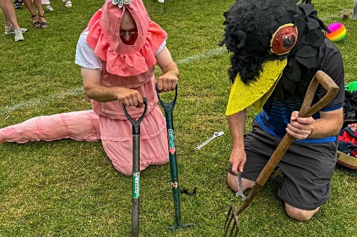 l-r Chris White as worm and Jonathan White as blackbird entice the worms (1)