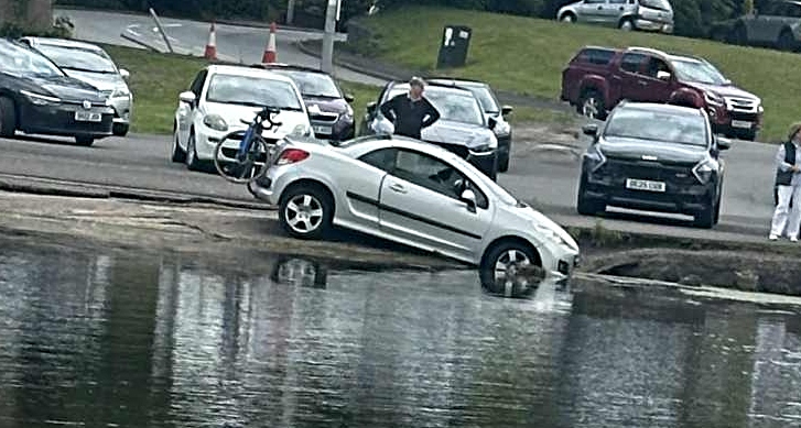 pic of car in lake - by adam shard
