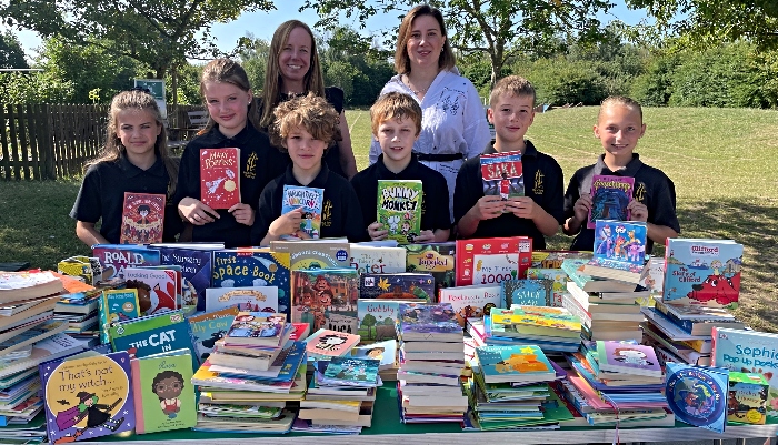 Kateryna, Leanie and Year 5 pupils at Pear Tree with books