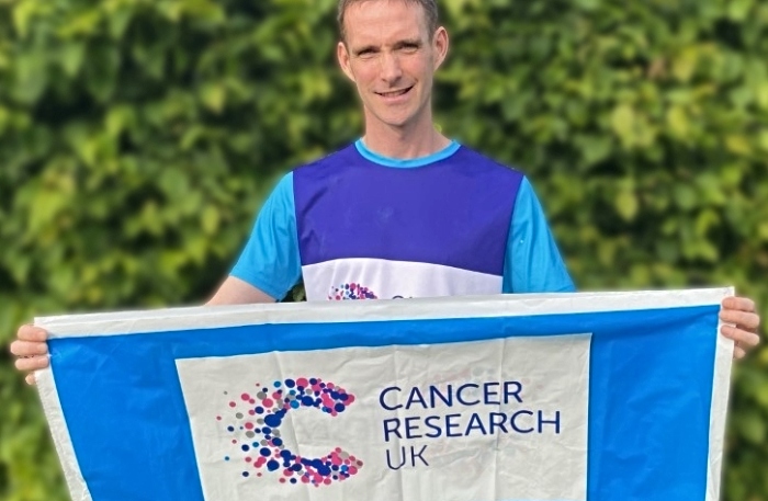 Paul Dean with Cancer Research UK banner (1)