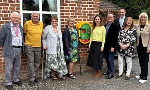 MP unveils new life-saving defibrillator at village hall in Wrenbury