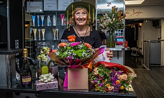 Denise with retirement gifts before she goes travelling