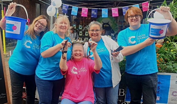Dee with family and friends after brave the shave
