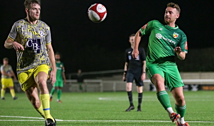 First-half - opposition players eye the ball (1)