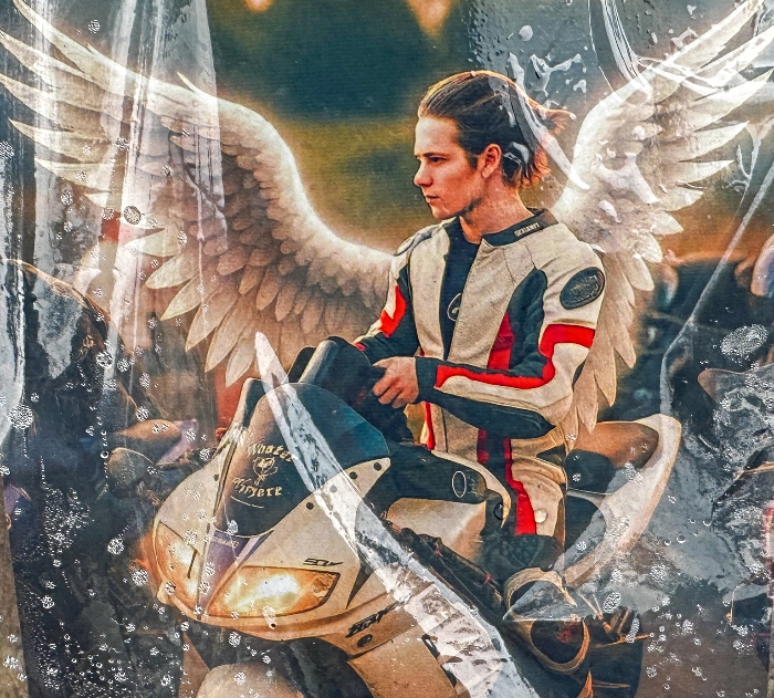 Motorcyclist with angel wings at shrine (1)