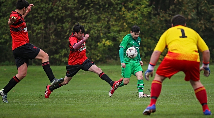 Nantwich Town's Danny Griggs crosses the ball under pressure (1)