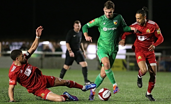 Second-half - Nantwich Town eye the ball under pressure (1)