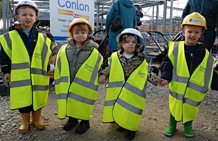 Young visitors to the building site were given hard hats and high-vis to wear