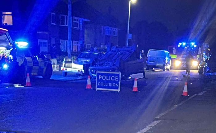 car on roof on Queens Drive