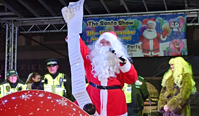 Father Christmas shows his long Nice List (1)