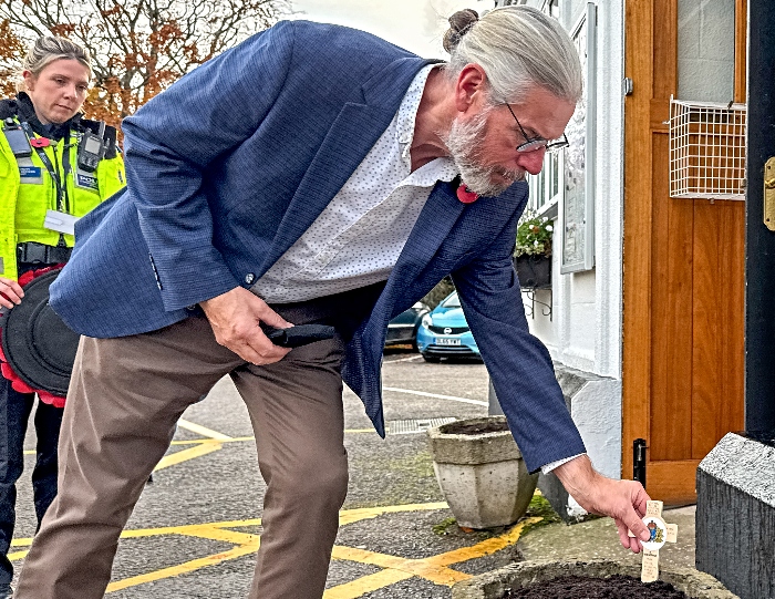 Steven Edge-Robinson places a wooden cross in memory of Lieutenant Commander Roy Berryman Edwards DSO (1)