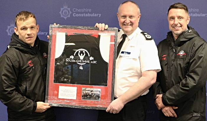 Chief Constable Mark Roberts with framed shirt