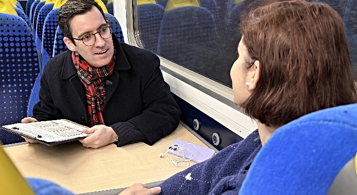 Dan Price on train speaking to a Cheshire resident (1)