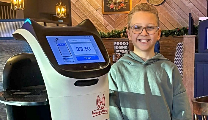 Wilson Laurie with Bella the robot - Macmillan fundraiser