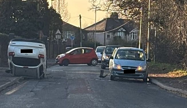 car ends on roof in Wistaston crash