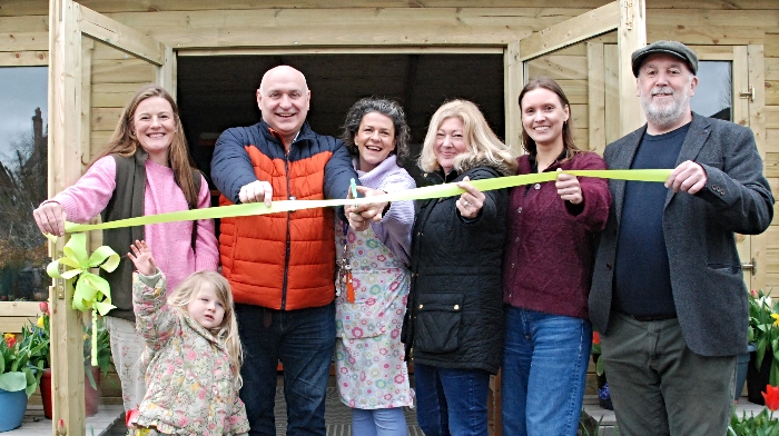 team at growing health community garden cabin
