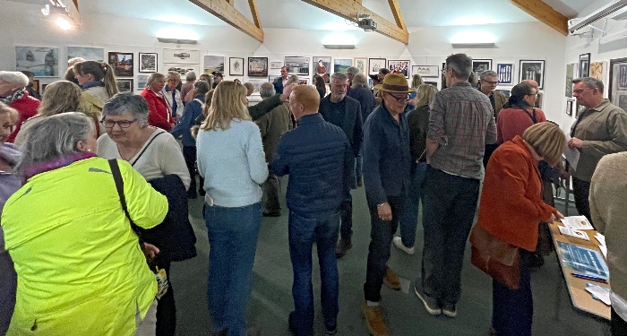visitors pack gallery for open art exhibition