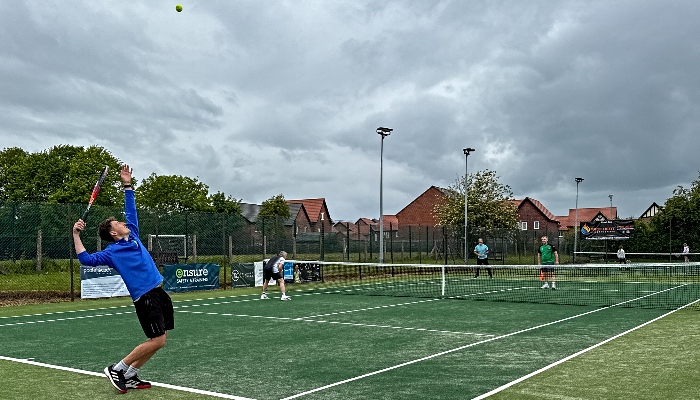 Players enjoy the new astroturf tennis courts