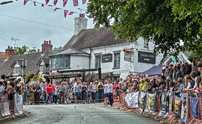 Competitor in the Adult race watch their pies roll on Main Road (1)