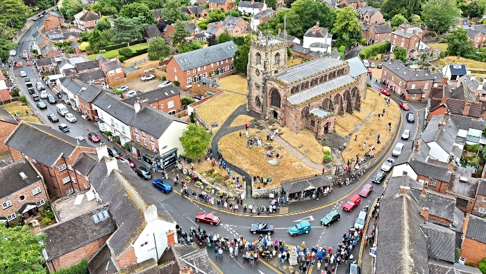 Aerial of transport parade through Audlem