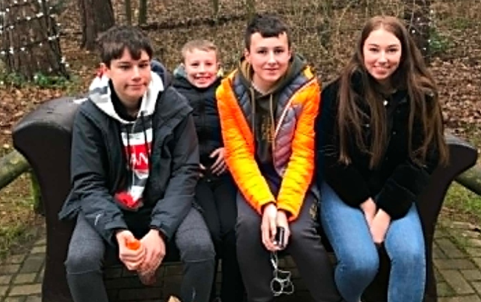 Lizzie with Josh (left) and brothers