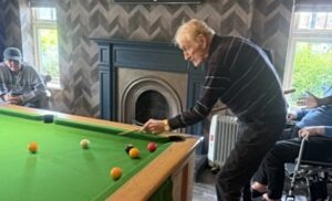 john playing pool - barony lodge men's den