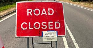 tried to warn you road closed sign