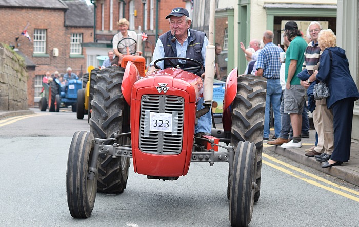 A Massey Ferguson tractor driver enjoys participating in the parade