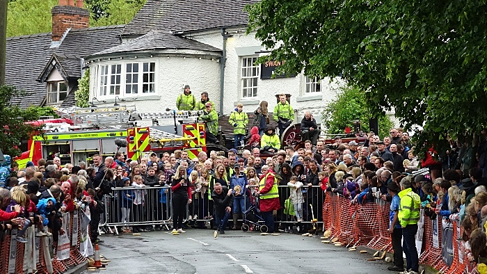 A competitor in the Adult race rolls on Main Road outside The Swan Inn (1)