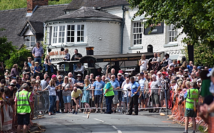 Fig pie - A competitor in the Adult race rolls outside the Swan Inn