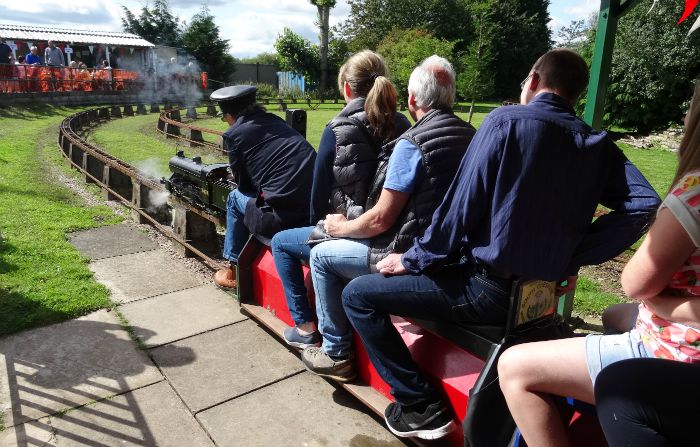 Model Engineering Society - A miniature-gauge steam train leaves the station