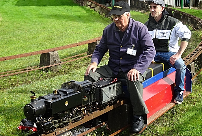 A visitor enjoys a miniature-gauge steam train ride (1)