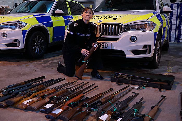 Acting Chief Constable Janette McCormick with firearms surrendered during campaign