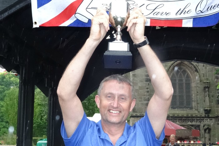 Adult race winner Ian Edwards with trophy - an impressive   112 metres