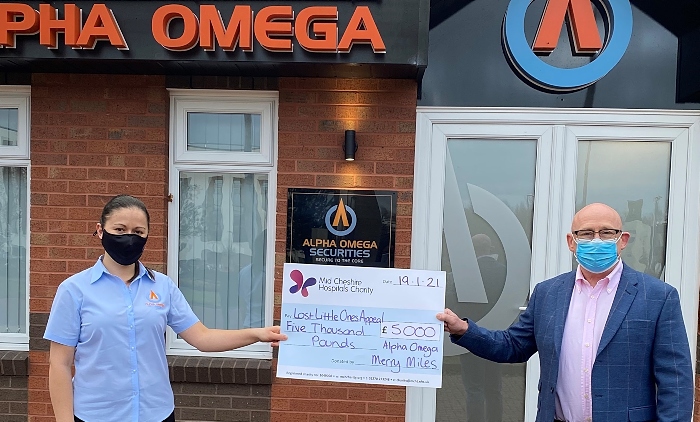 Alpha Omega and cheque - hospital charity