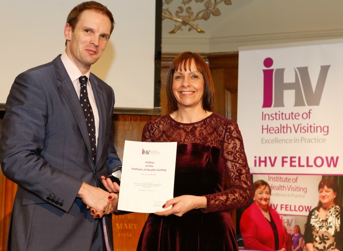 Health visitor Andrea Johns Fellowship award with Daniel Poulter MP