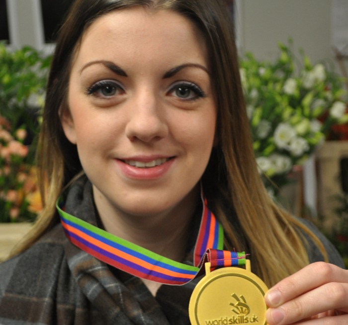 Anna Eite wearing gold medal