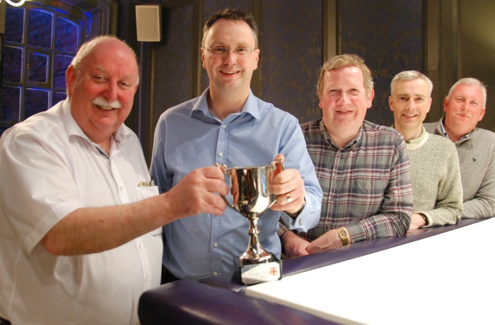 Quiz - BCR managing director Phil Wood hands over the trophy to the NatWest business banking team
