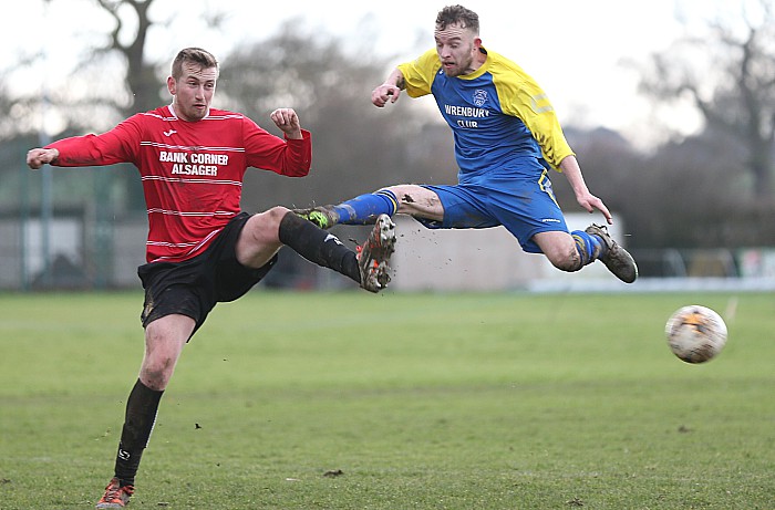 Bank Corner clear the ball under pressure