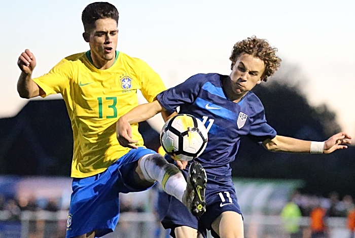 Brazil player Yan Bueno Couto and US player Griffin Yow fight for the ball (1)