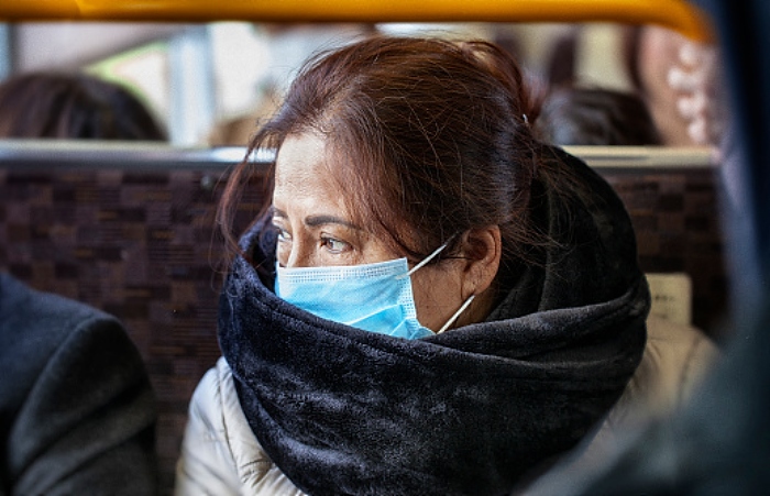 Bus passenger in mask (stock image) (1)