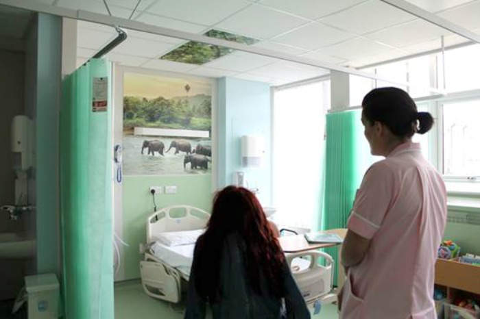 Caitlin Shaw (left) is given a tour of the refurbished children’s ward during its official opening.