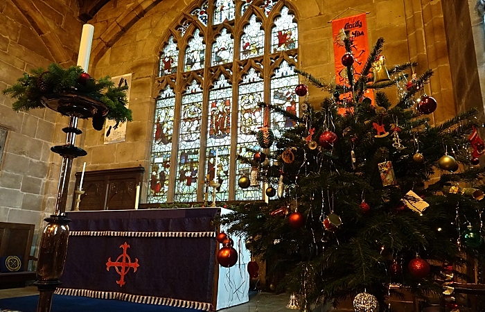 Candle decoration and decorated tree adjacent to the altar (1)