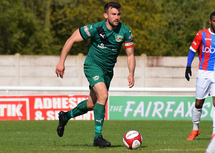 Captain Sam Hall on the ball