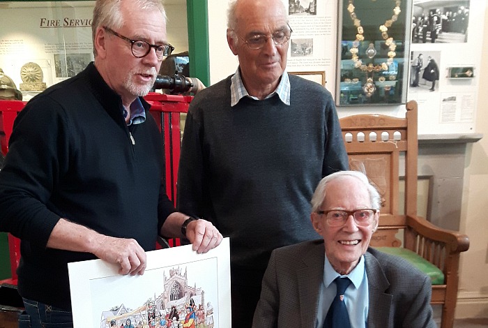 volunteer - Chair of Nantwich Museum Trustees, Nick Dyer presents Allan Whatley with a painting Nantwich Medieval Market as local historian