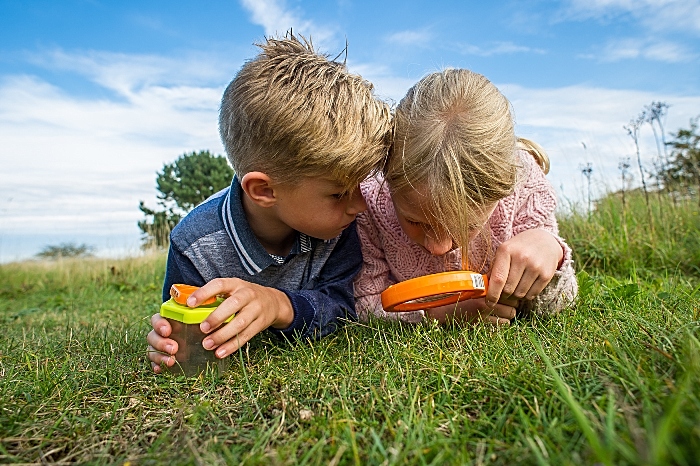 Cheshire Wildlife Trust breakfast challenge - Children exploring with magnifier (c) Matthew Roberts